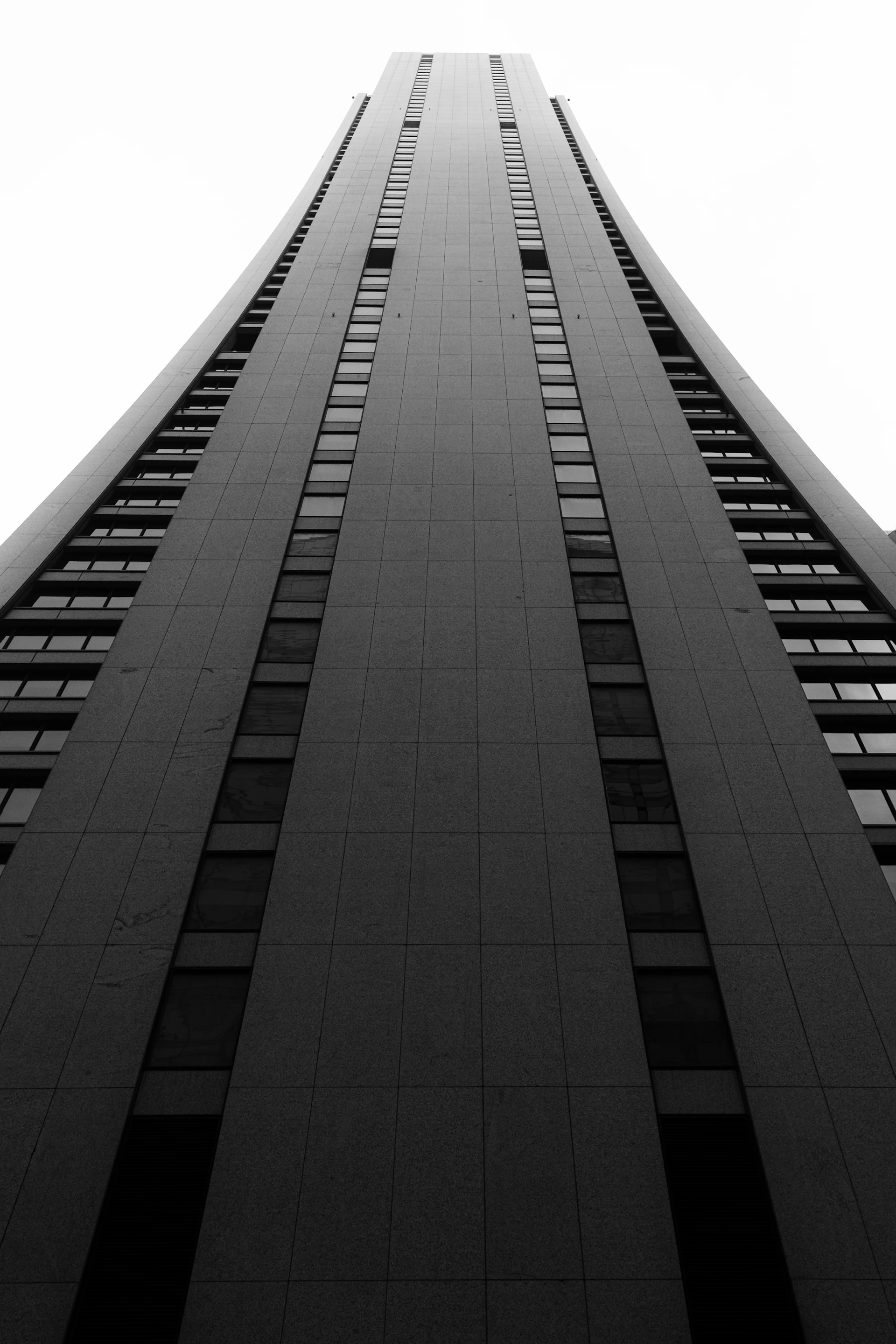 a black and white photo of a tall building