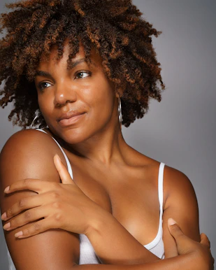 a close up of a person wearing a tank top