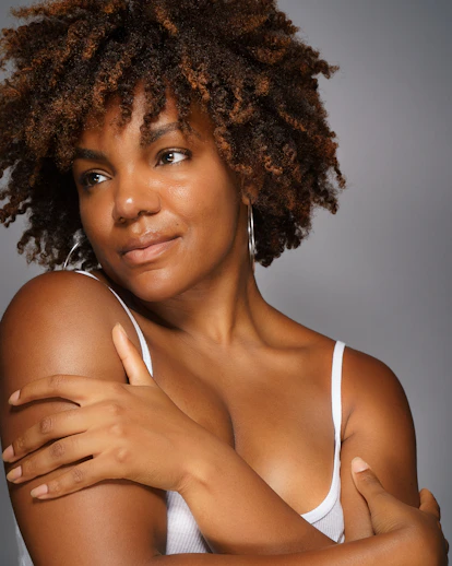 a close up of a person wearing a tank top