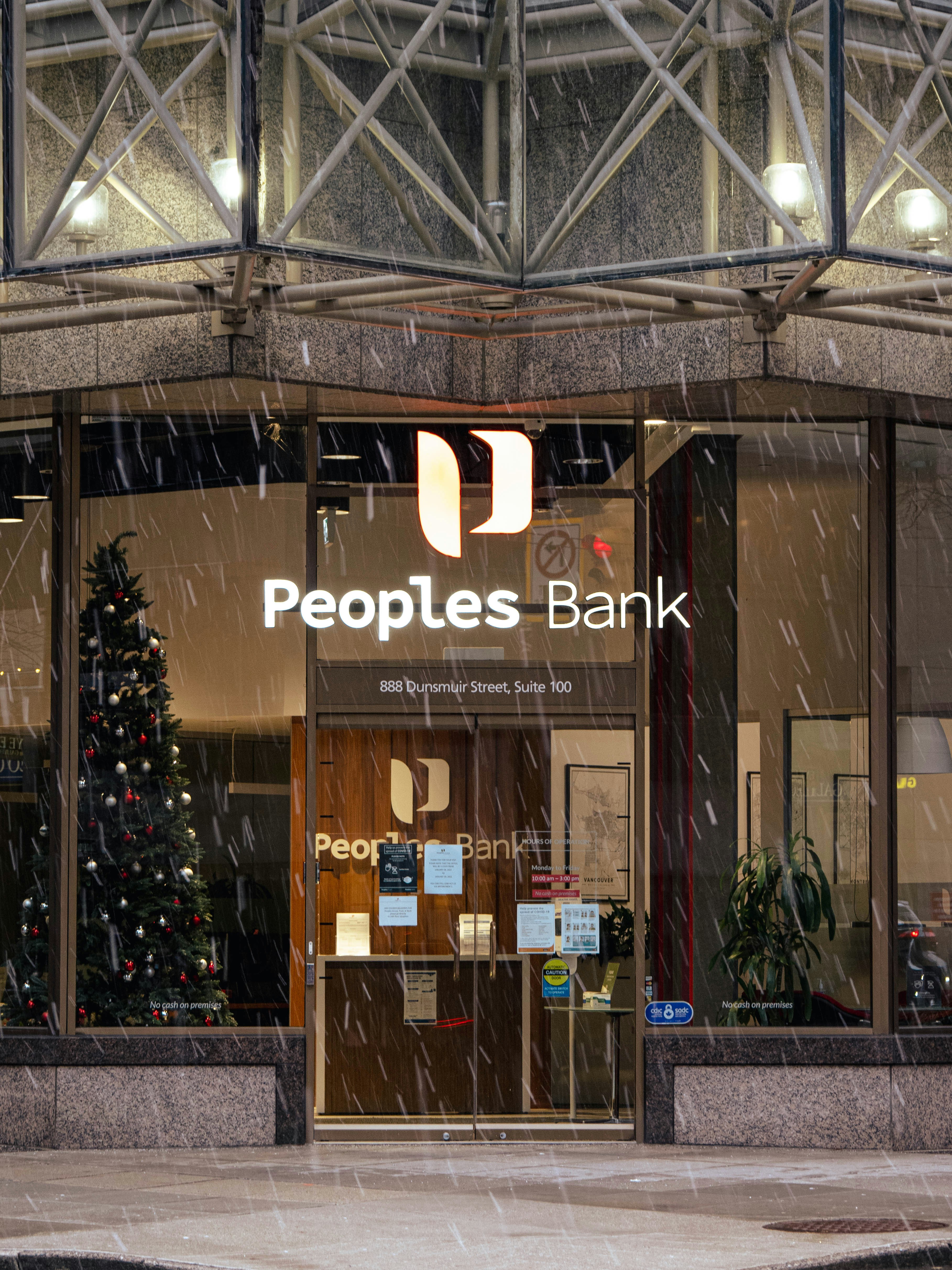 people's bank building in the rain with a christmas tree