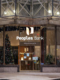 people's bank building in the rain with a christmas tree