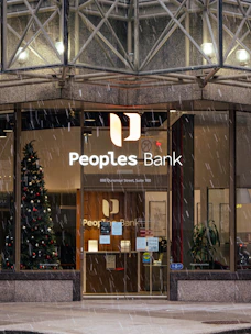 people's bank building in the rain with a christmas tree