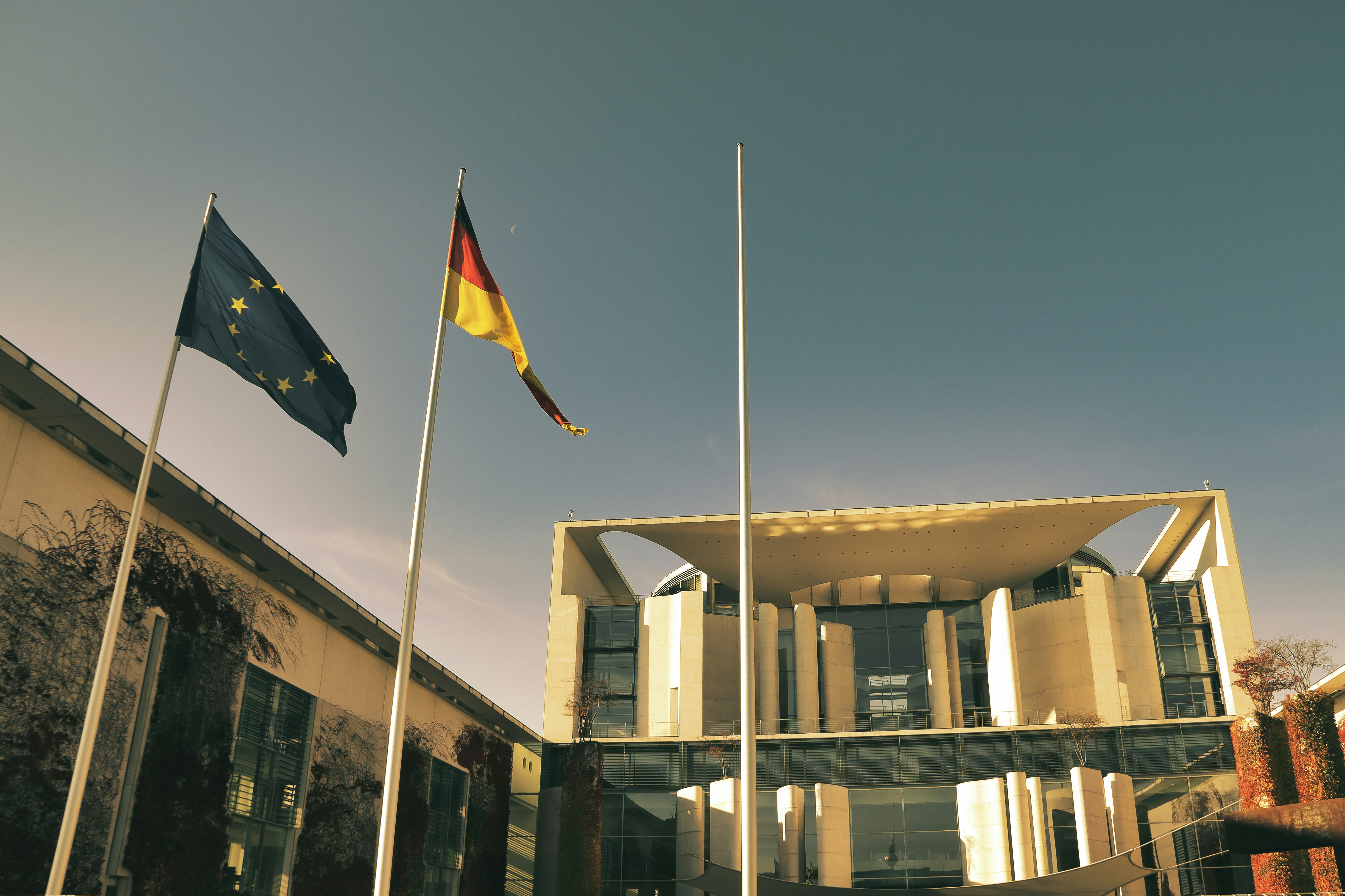 a building with flags flying in front of it