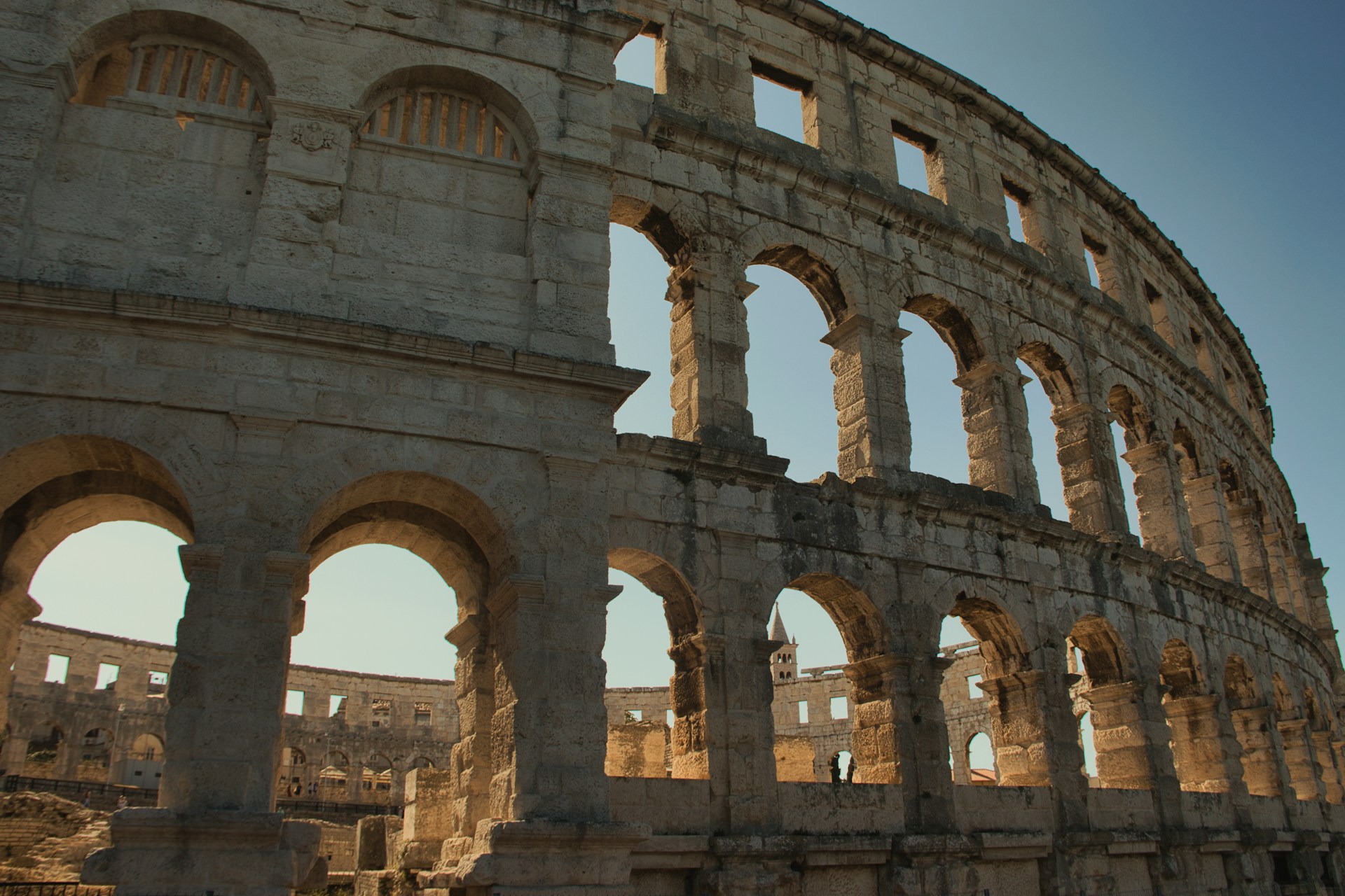 a large stone building with arches and arches