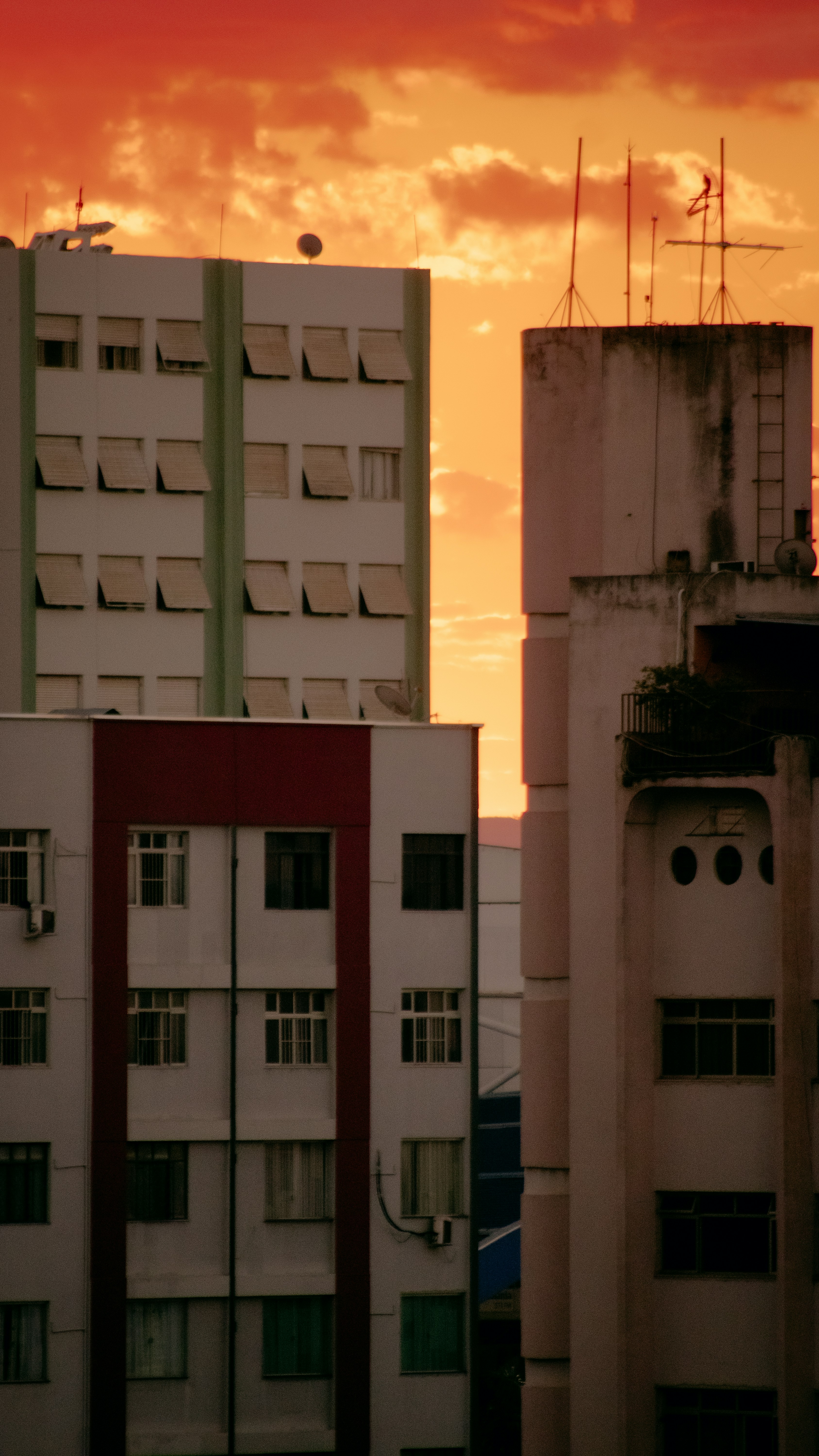 a red and white building and some buildings