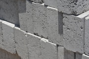 a close up of a brick wall made of cement