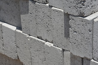 a close up of a brick wall made of cement