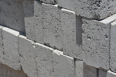 a close up of a brick wall made of cement