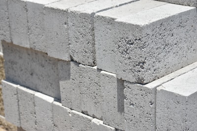 a stack of cinder blocks sitting on top of a sidewalk
