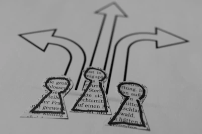 a close up of a piece of paper with arrows