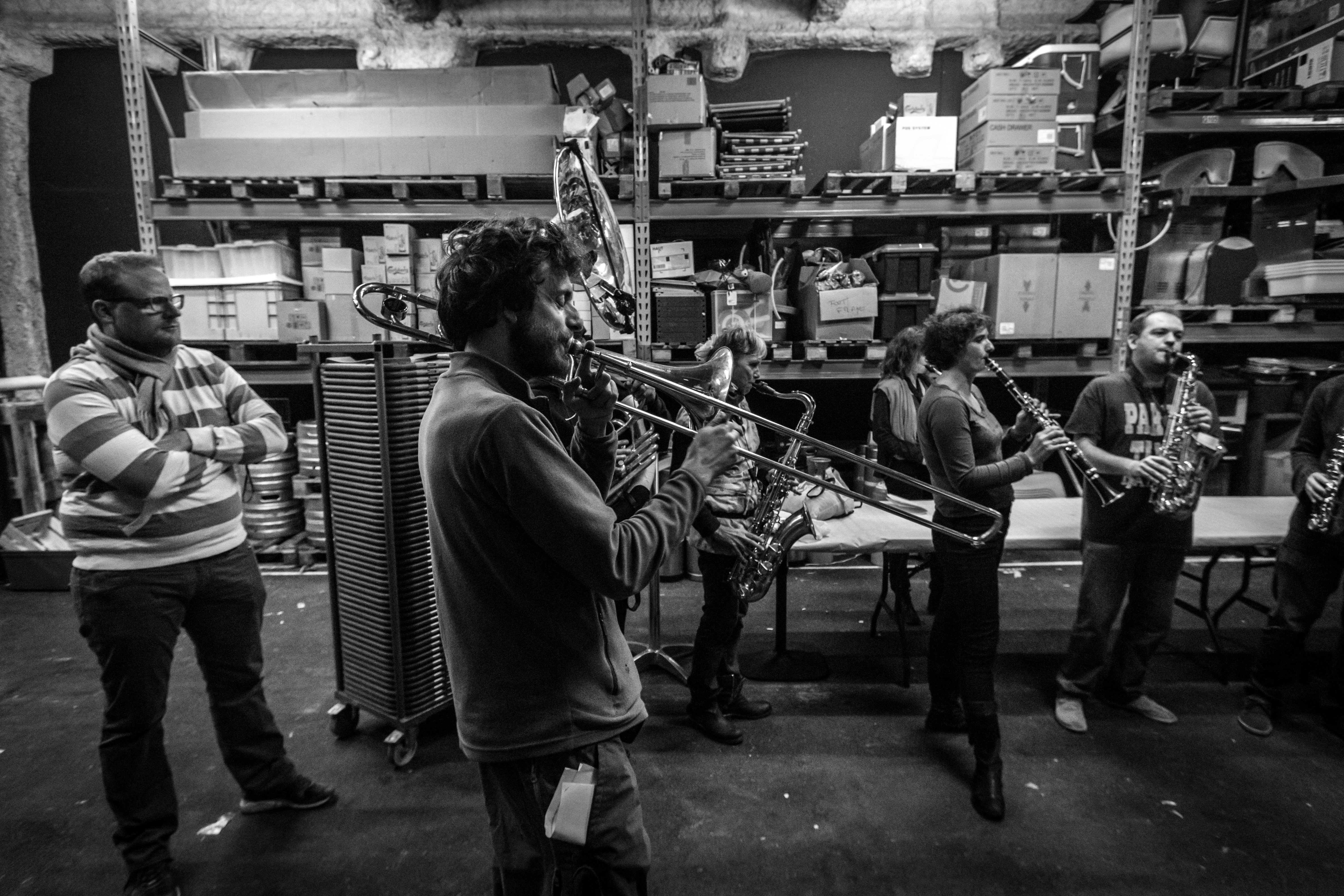 a group of men playing instruments in a room