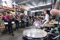 a group of people playing instruments in a room
