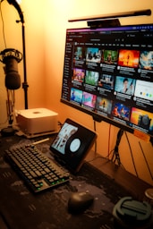 a computer desk with a monitor, keyboard and mouse