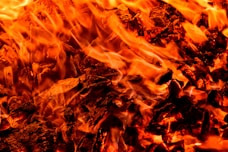 a close up of a fire with bright orange flames