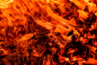 a close up of a fire with bright orange flames