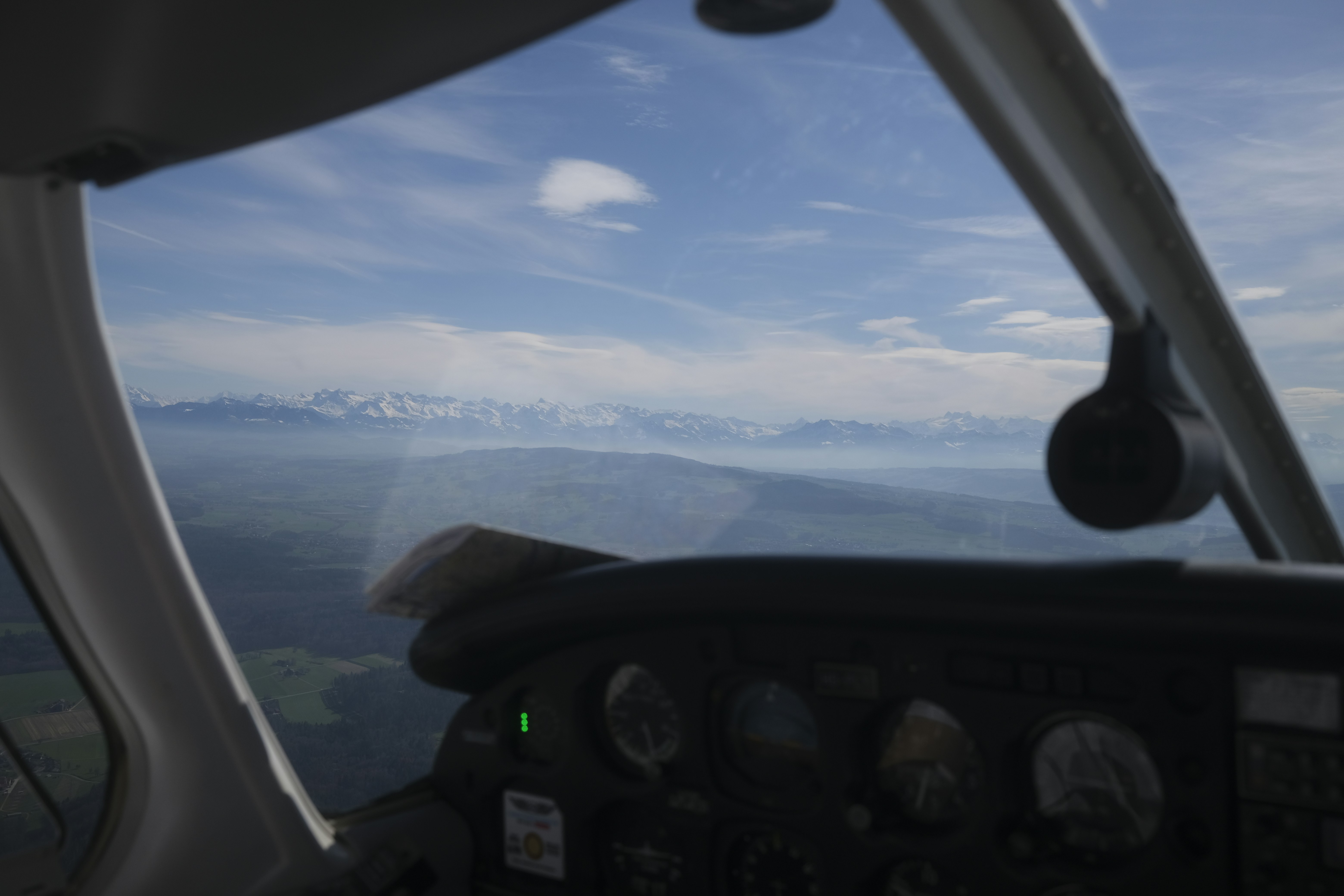 a view of the mountains from inside a plane