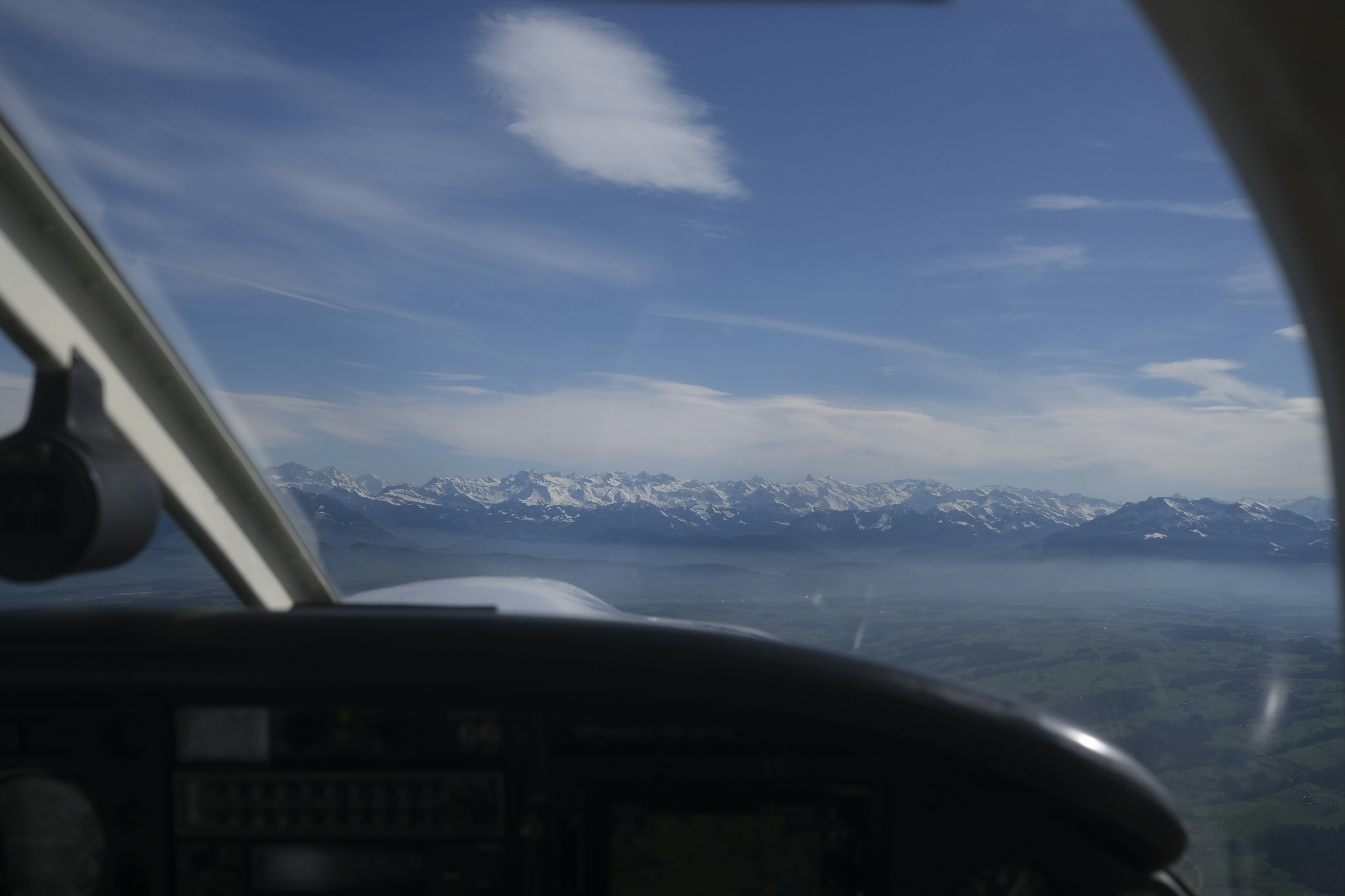 a view of the mountains from inside a plane