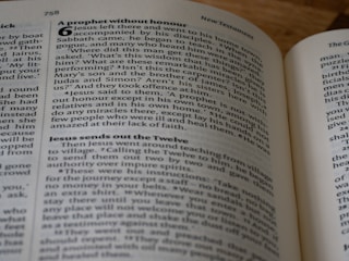 a close up of an open book on a table