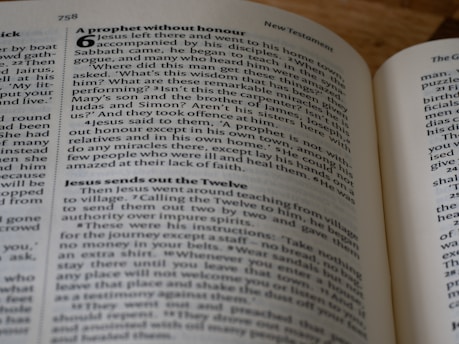 a close up of an open book on a table