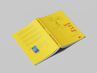 a yellow book with a picture of a man's face on it