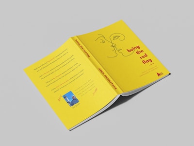 a yellow book with a picture of a man's face on it
