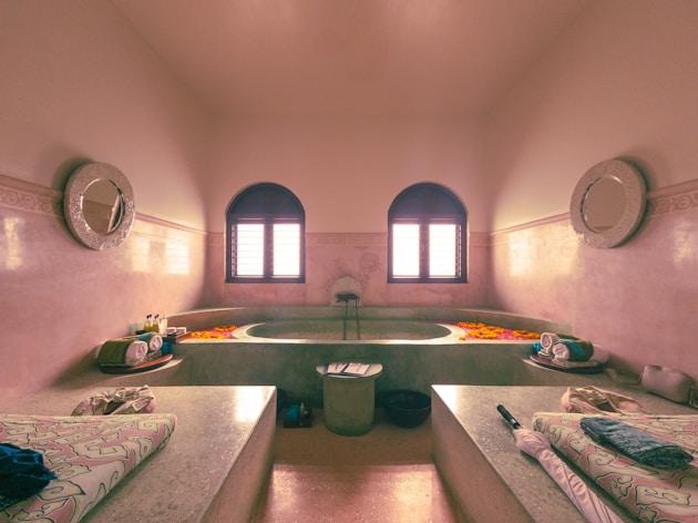 a bathroom with a large tub and a sink