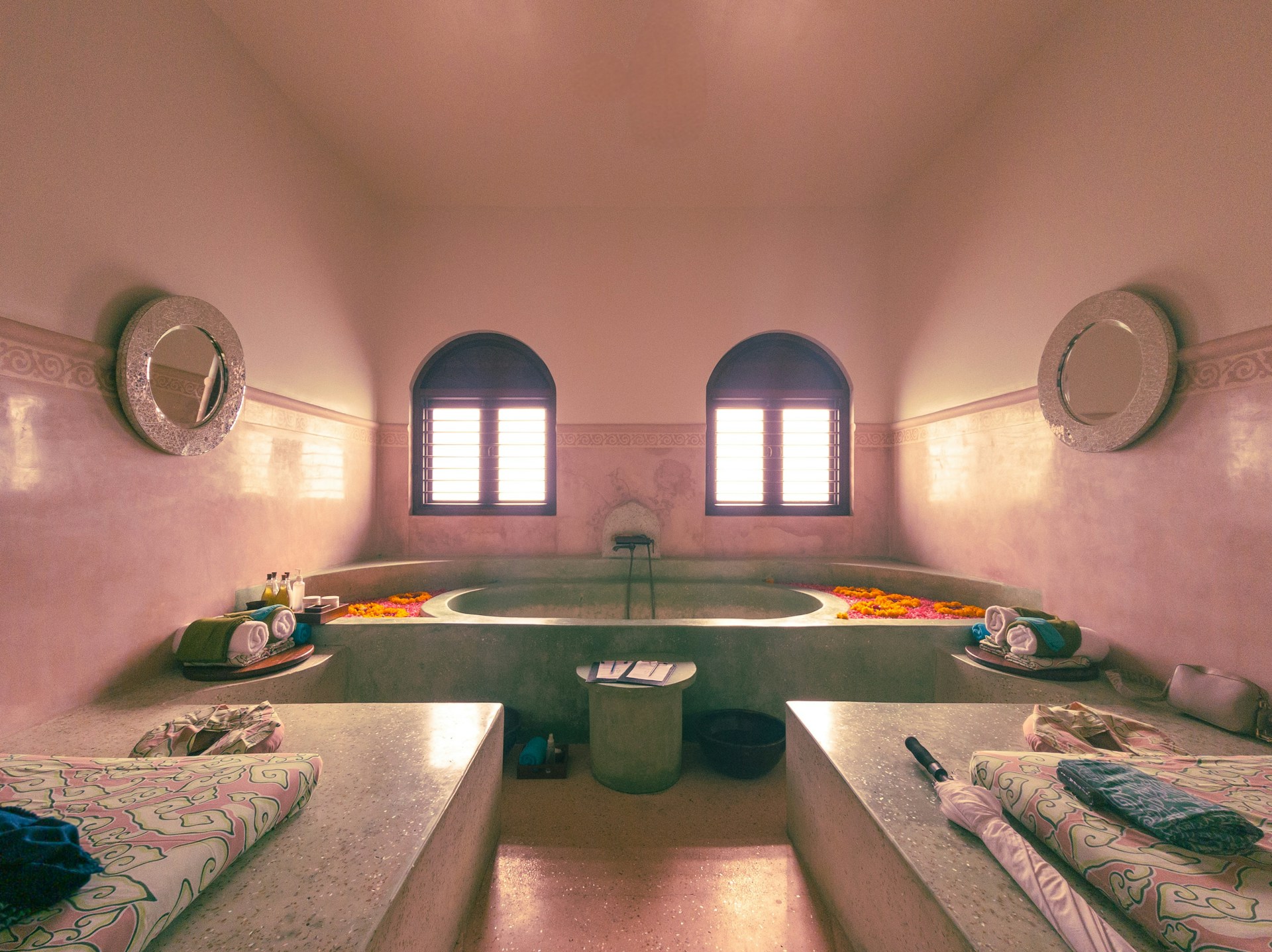a bathroom with a large tub and a sink