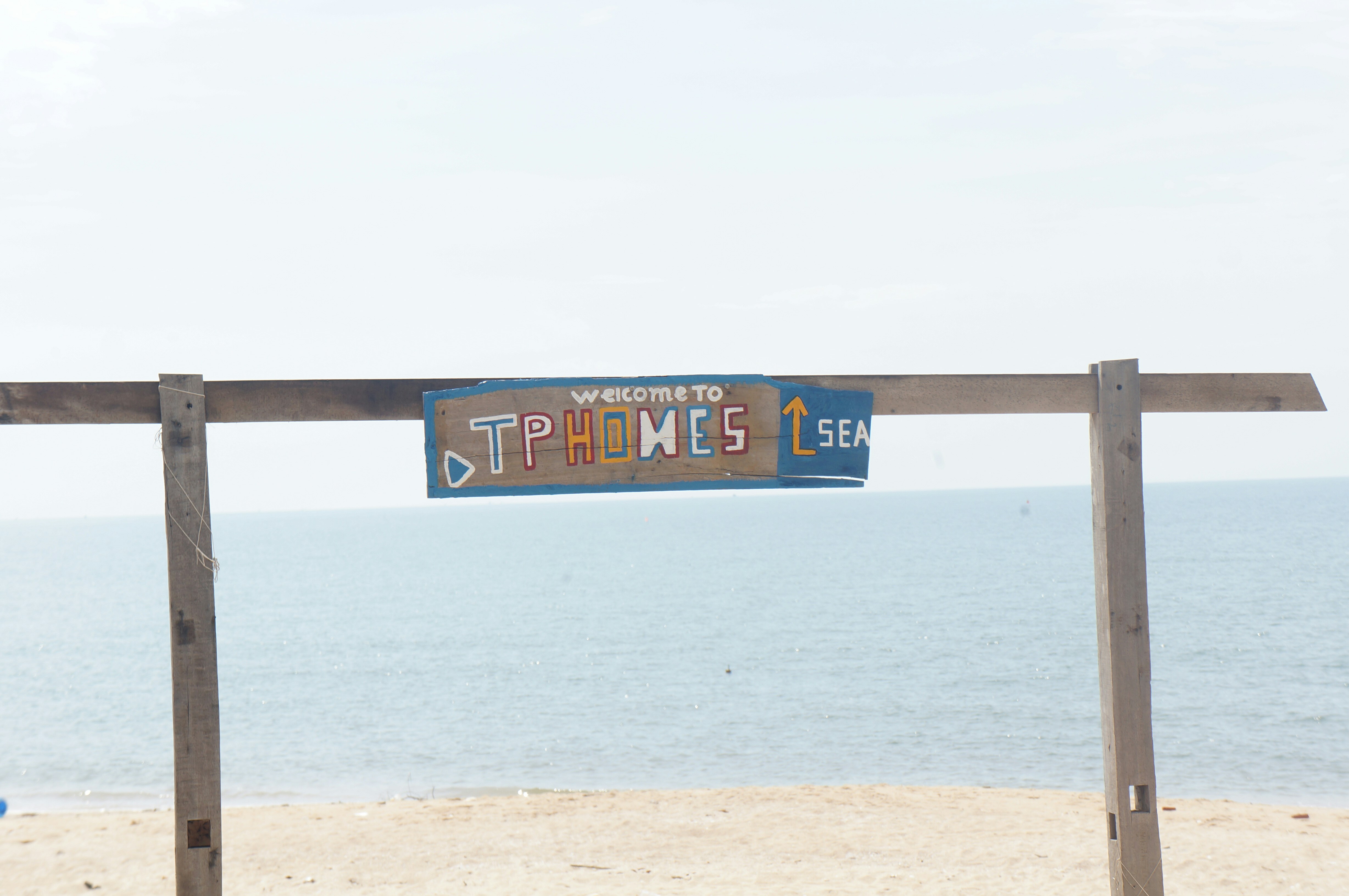 a sign that is on a wooden fence