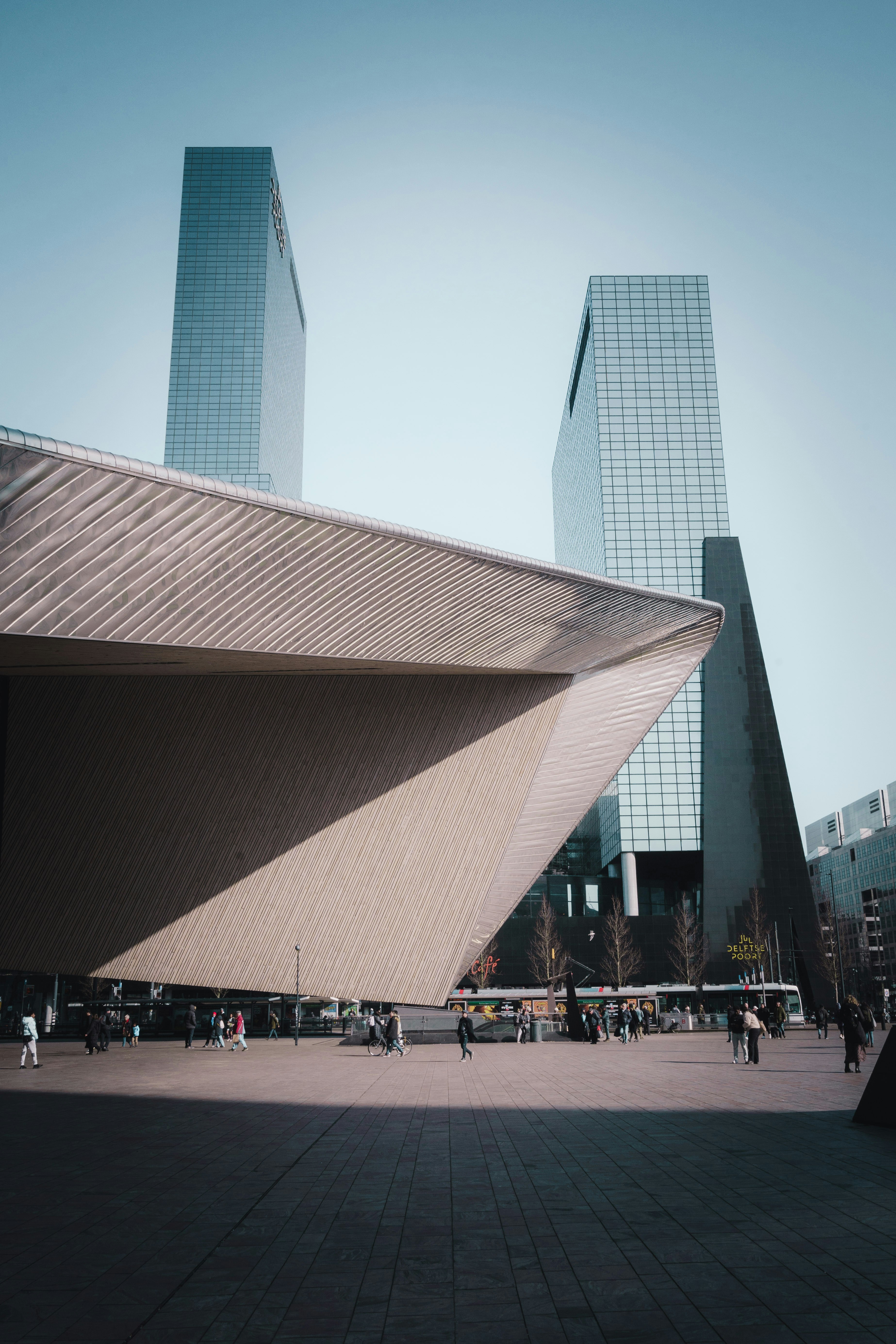 a large building with a very tall building in the background