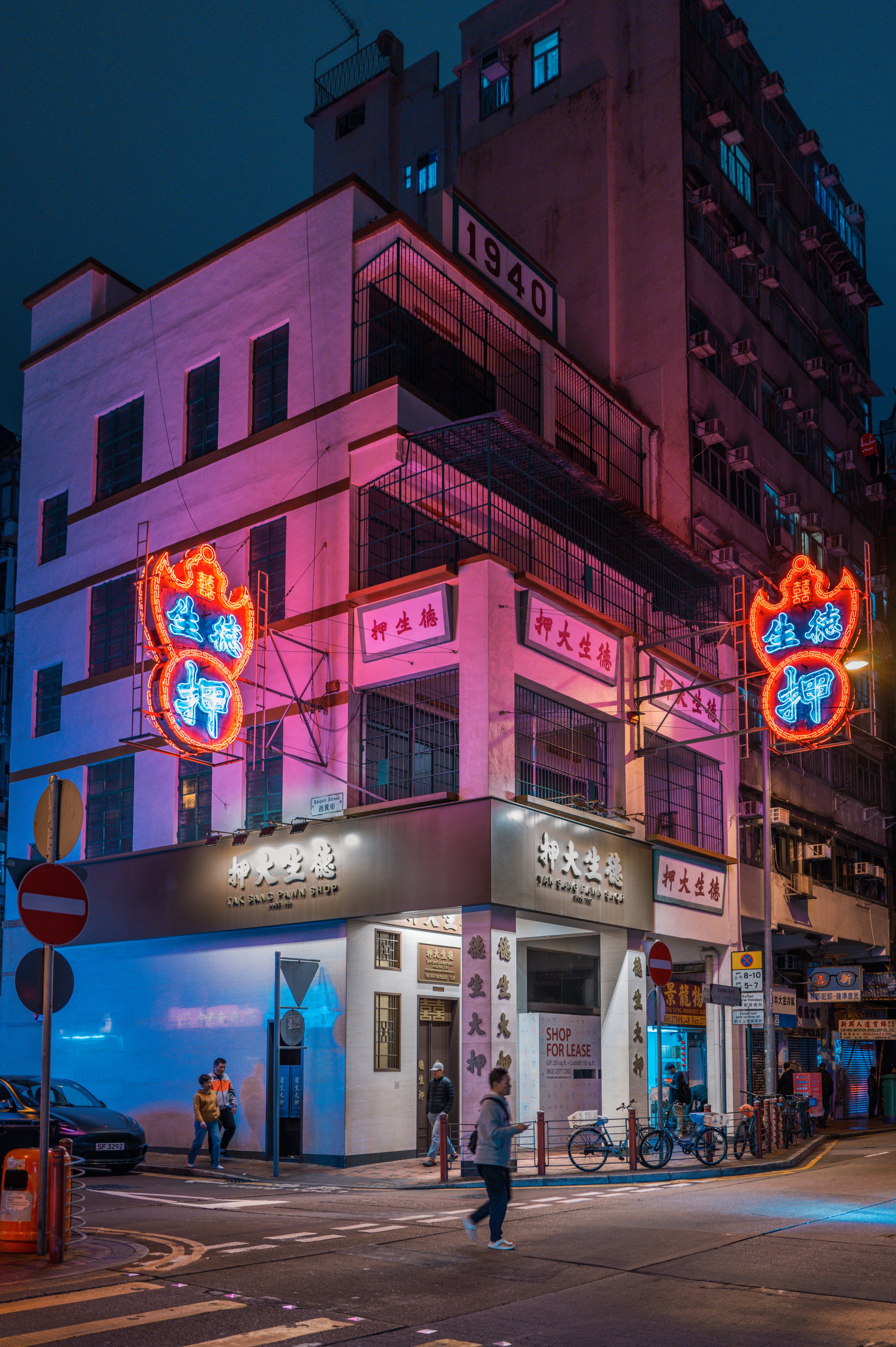 a person crossing a street in front of a building