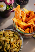 Dried mango slices and raisins in glass jars