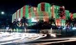 a building is lit up with christmas lights