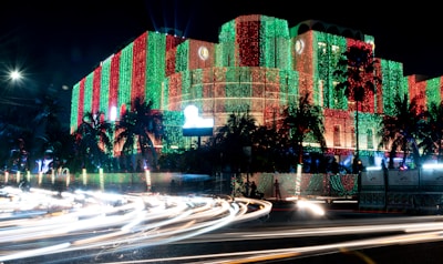 a building is lit up with christmas lights