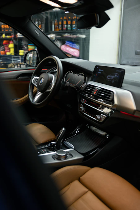 the interior of a car with a dashboard and steering wheel