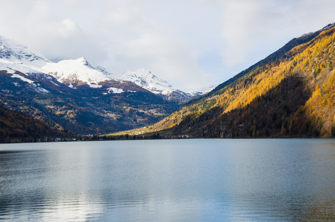 a large body of water surrounded by mountains,