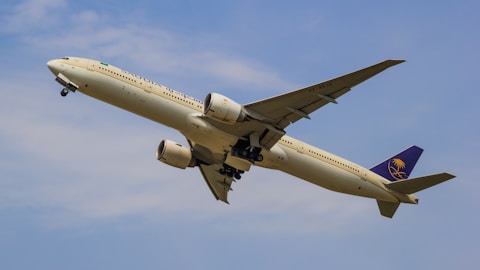 a large passenger jet flying through a blue sky
