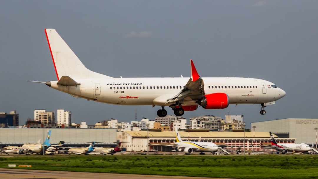 a large jetliner taking off from an airport runway, Batik Air Boeing 737 MAX 8