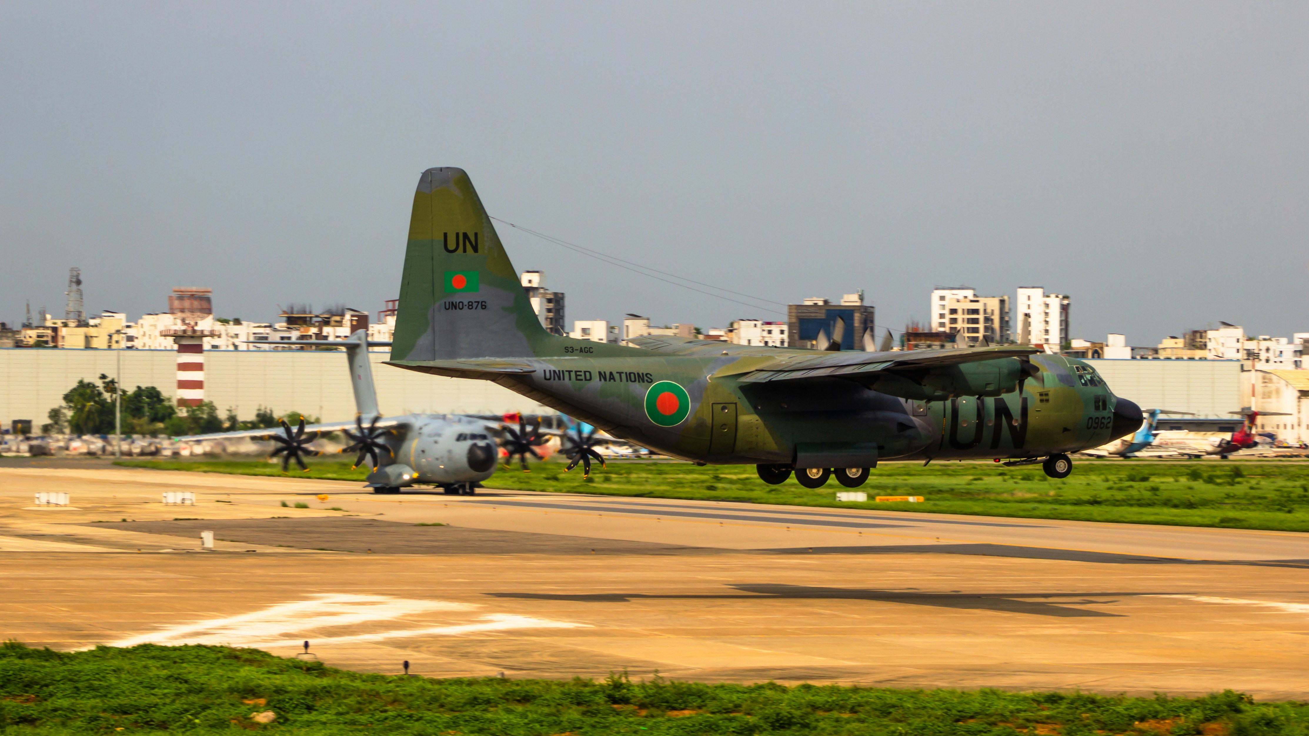 a military plane taking off from an airport runway, Bangladesh Air Force
