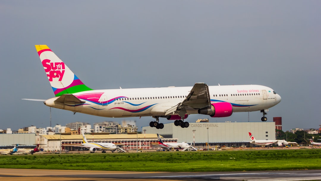 a large jetliner taking off from an airport runway, Sunday Airlines Boeing 767-300ER