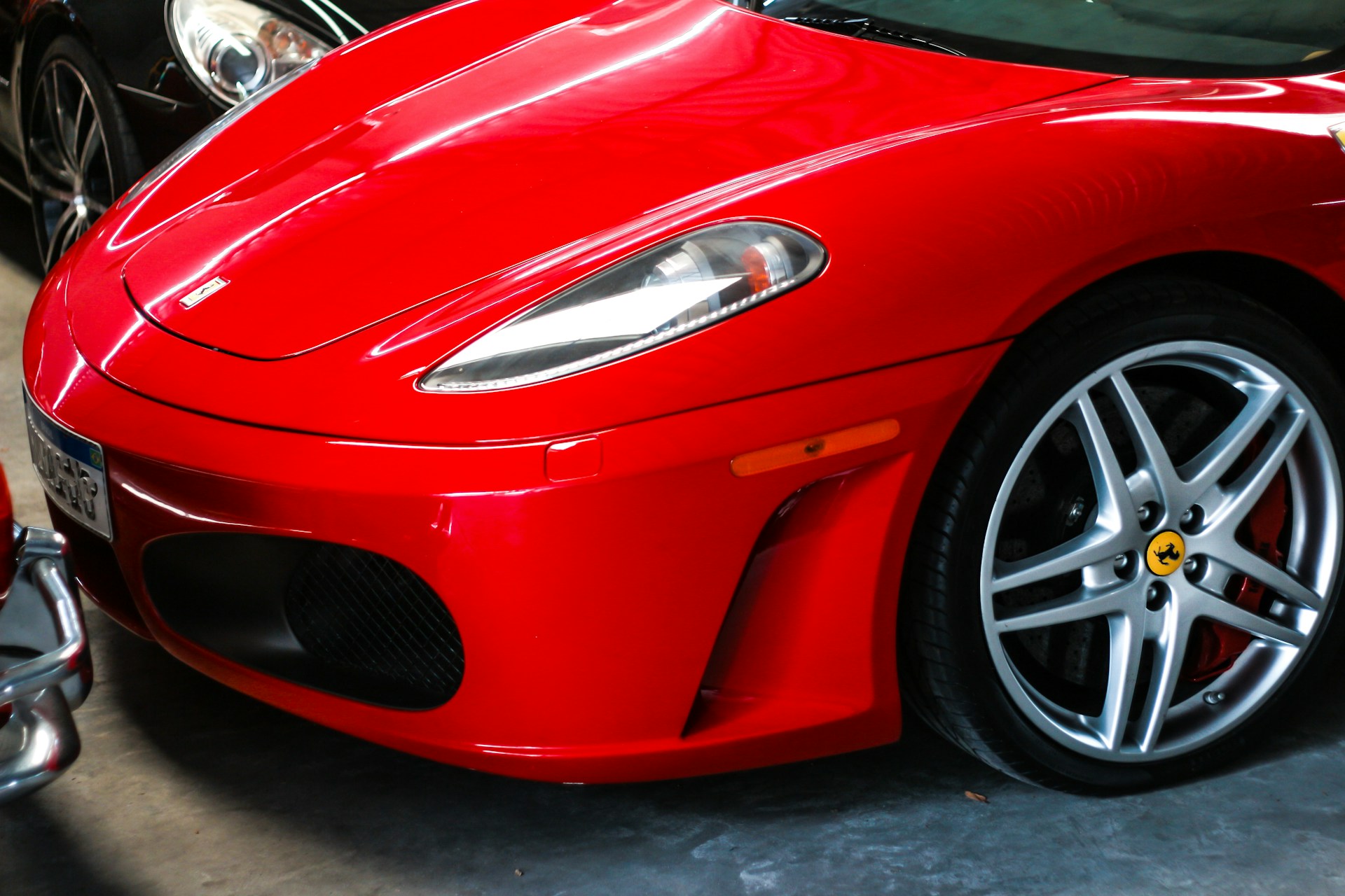 a red sports car parked in a garage