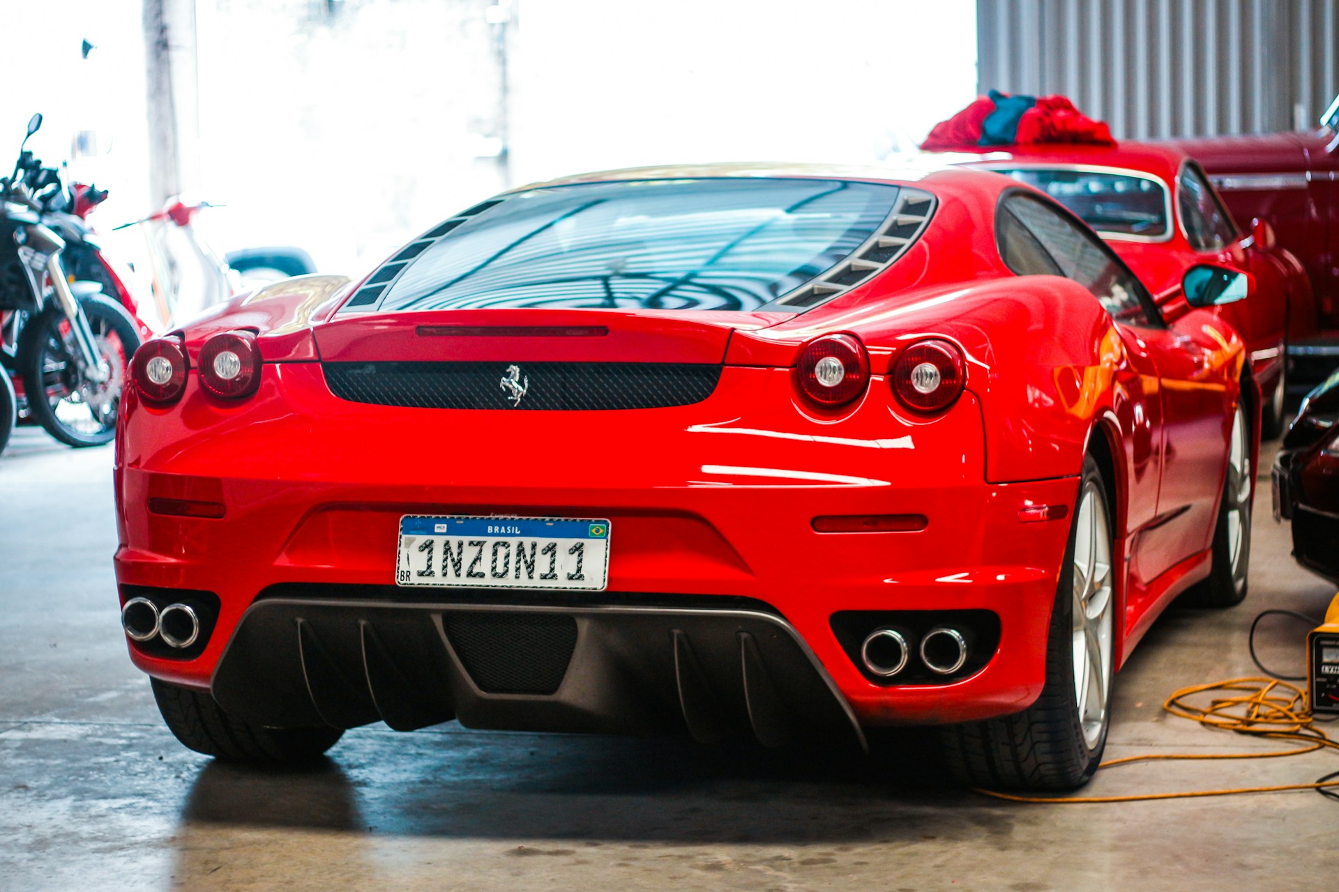 a red sports car parked in a garage