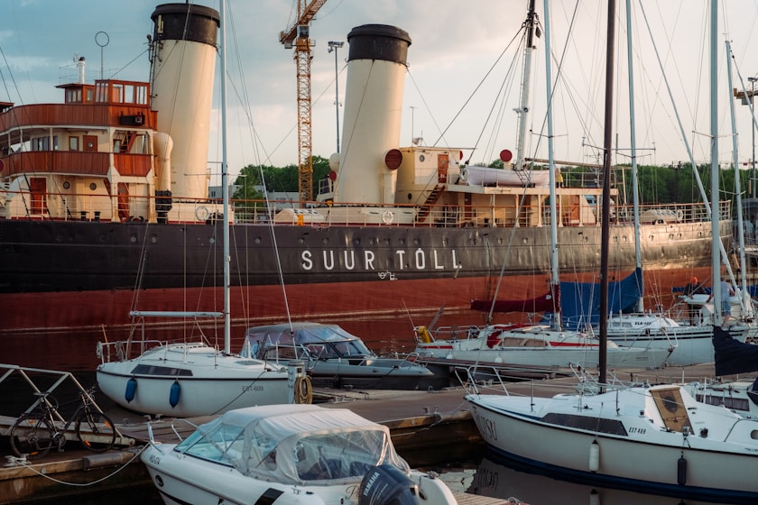 a group of boats that are sitting in the water