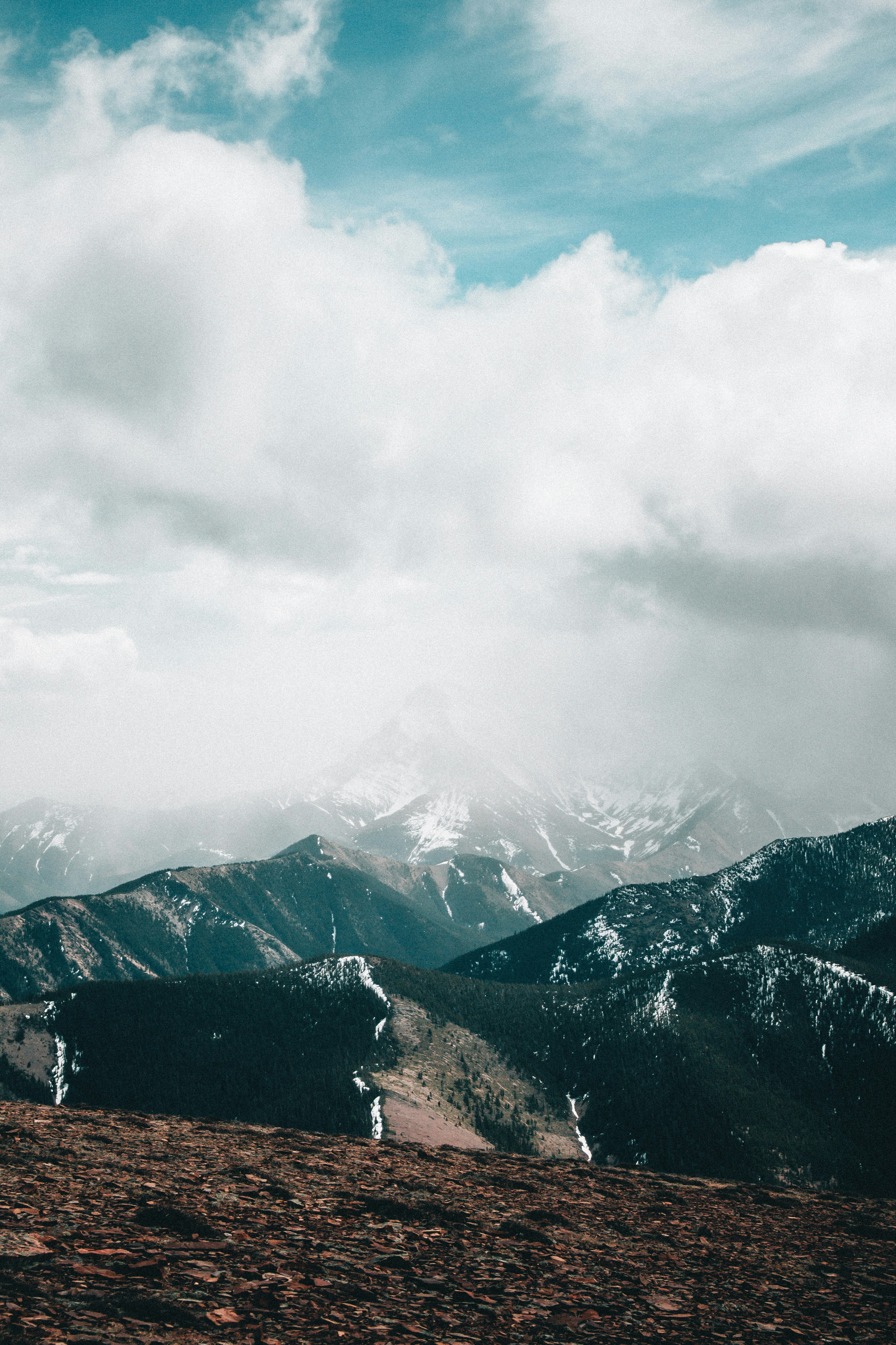 a man riding a horse on top of a mountain