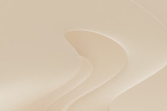 a man riding a snowboard down a snow covered slope