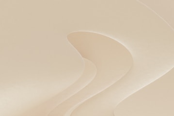 a man riding a snowboard down a snow covered slope