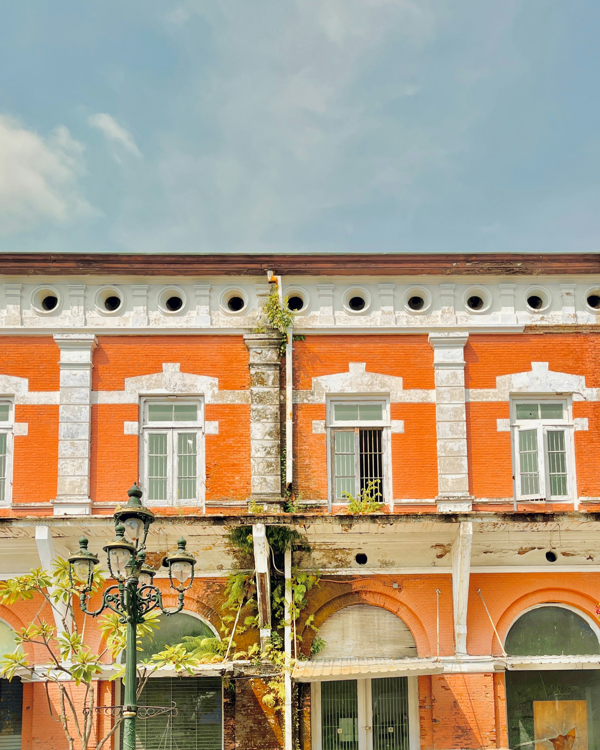an orange building with a clock on the front of it