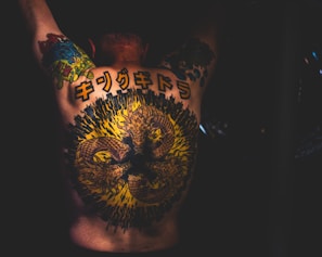 a man with a tattoo on his back