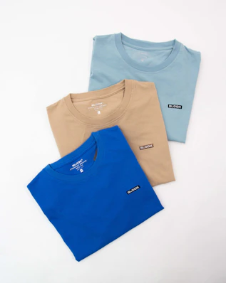 three colors of t - shirts on a white background