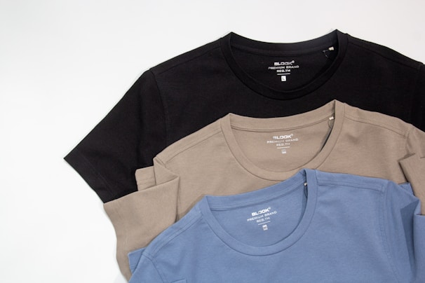 a group of three shirts sitting next to each other