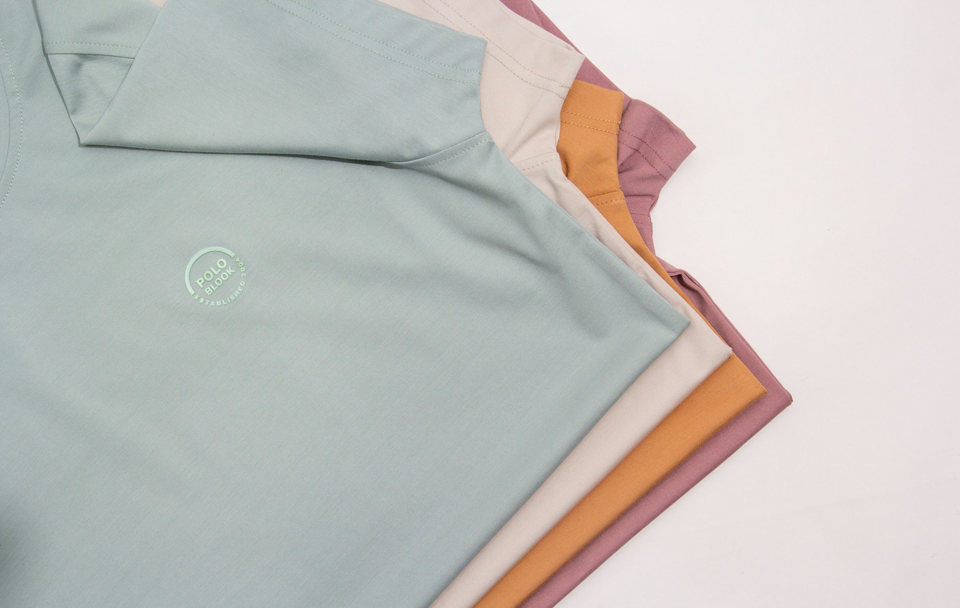 a close up of a shirt on a white surface